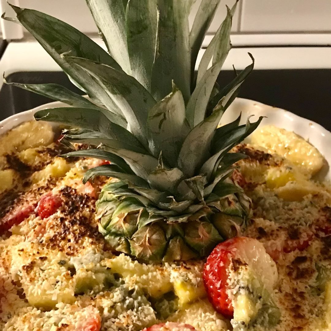 Close-up of fruit dessert with pineapple, strawberries, and coconut